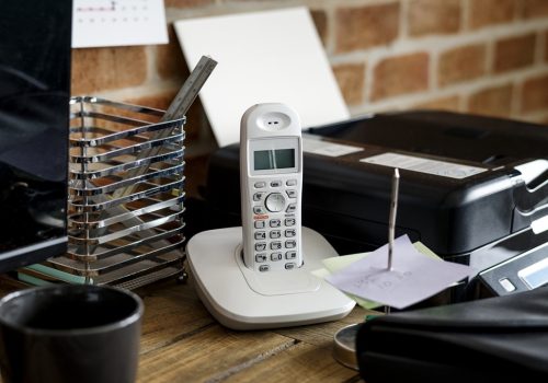 Closeup of landline phone on wooden table